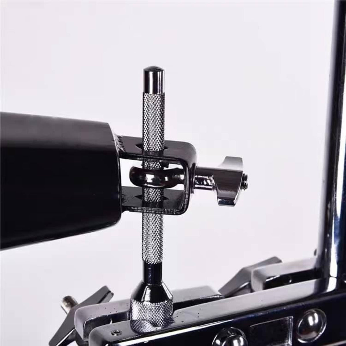 Black cowbell with chrome mounting hardware and threaded knob