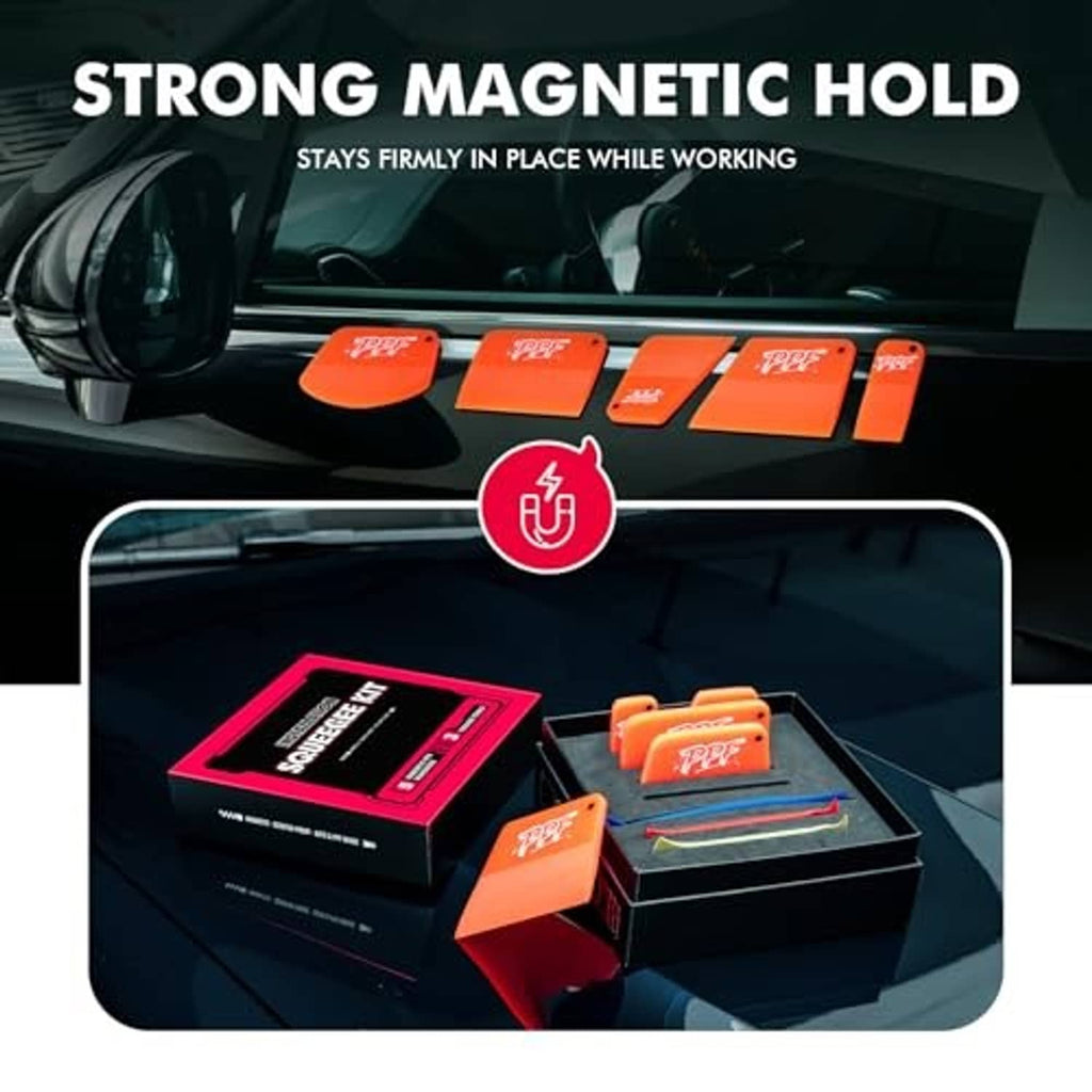 PPF squeegee set with several orange tools displayed on black work surface.