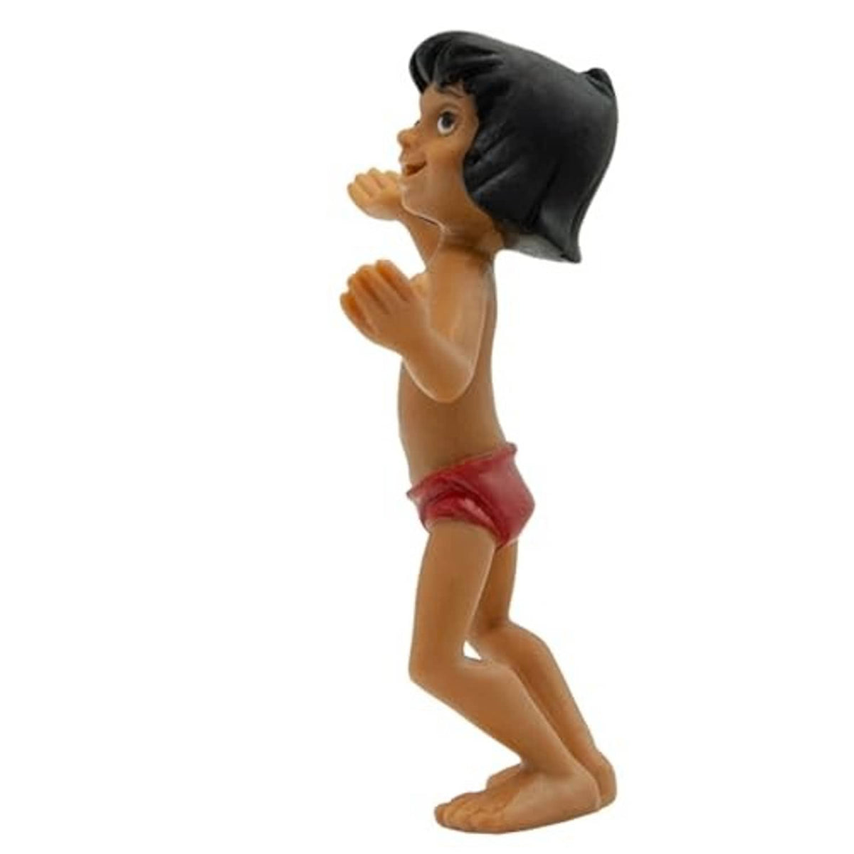 Mowgli hand-painted toy figurine side view, black hair, red shorts, hands near chest