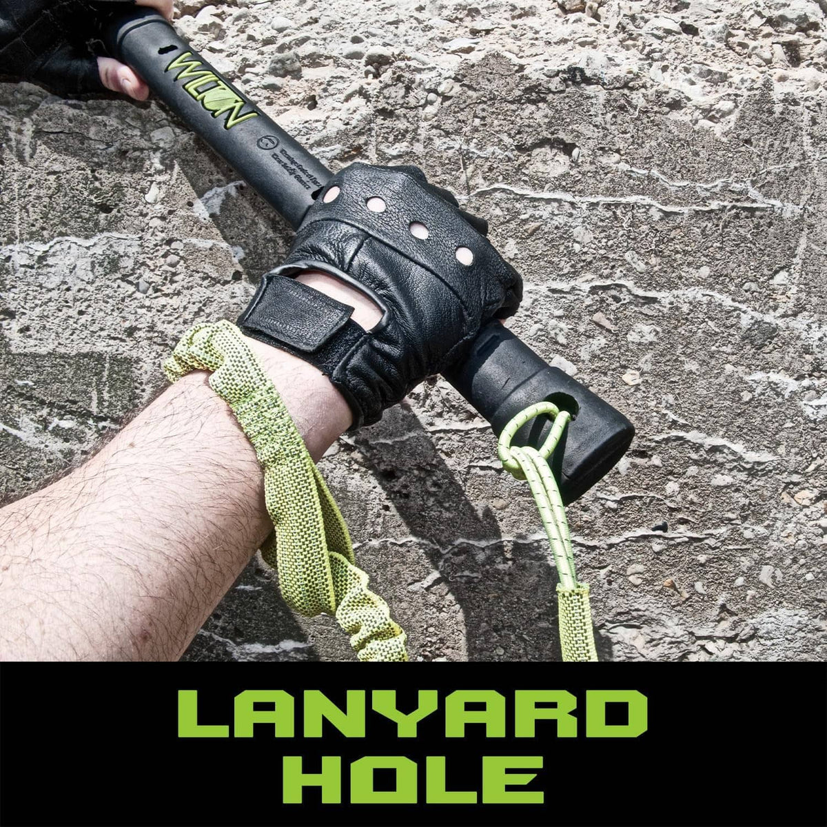 Neon green sledge hammer with black handle and hanging strap, gloved grip close-up