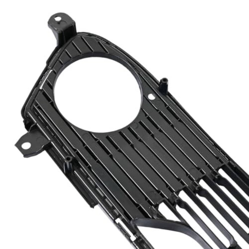 Front bumper lower grille close-up, black frame with round opening and vertical rib slats