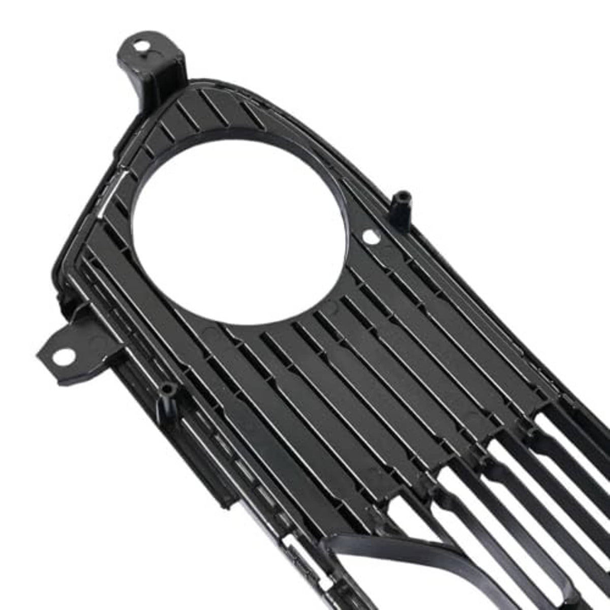 Front bumper lower grille close-up, black frame with round opening and vertical rib slats