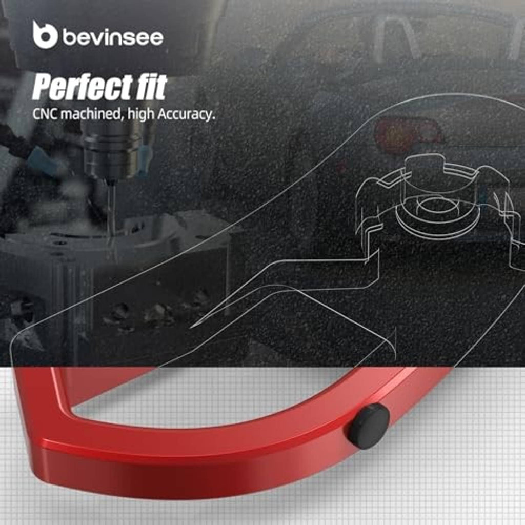 Red hood latch release lever handle bracket with black rubber cap and oval cutout.