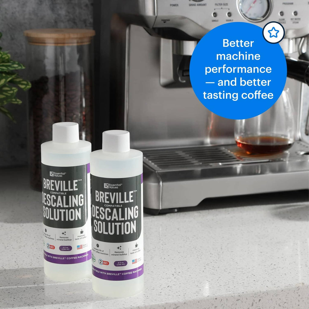 Two descaling solution bottles on countertop beside a coffee machine