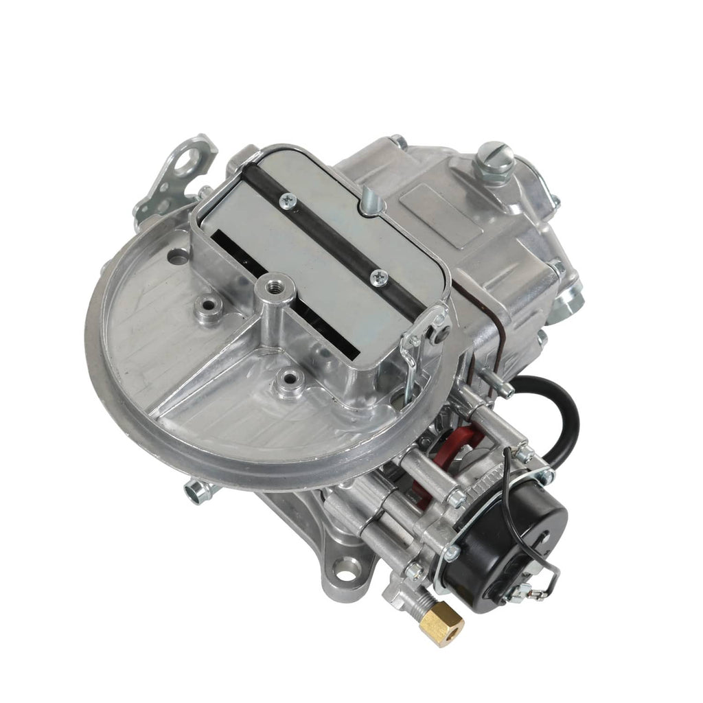 Two-barrel carburetor with electric choke housing and fuel fitting, angled view