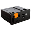 Black wired CarPlay/Android Auto adapter box with USB, AUX, and orange insert