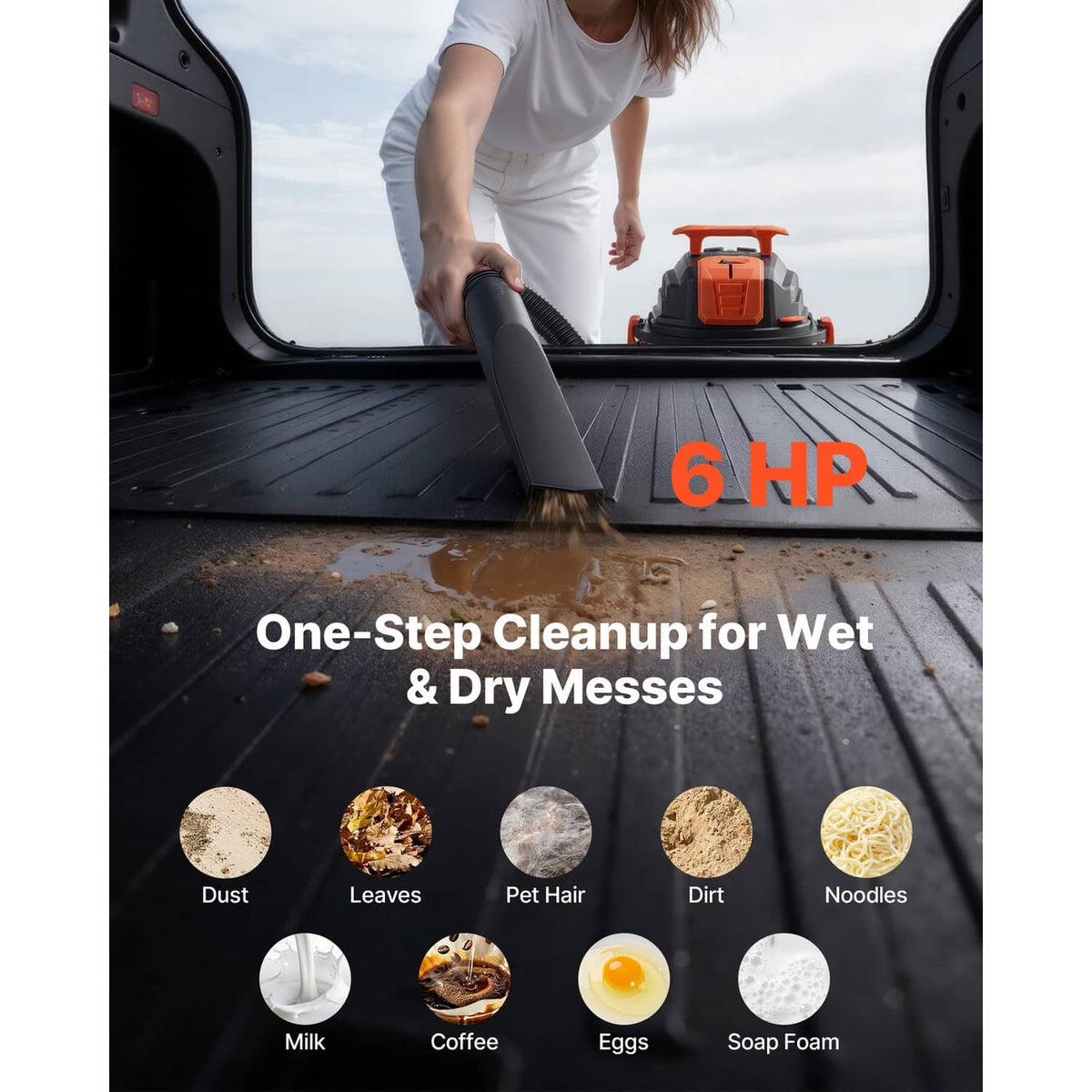Wet/dry vacuum cleaner with floor brush attachment, orange top, and silver tank