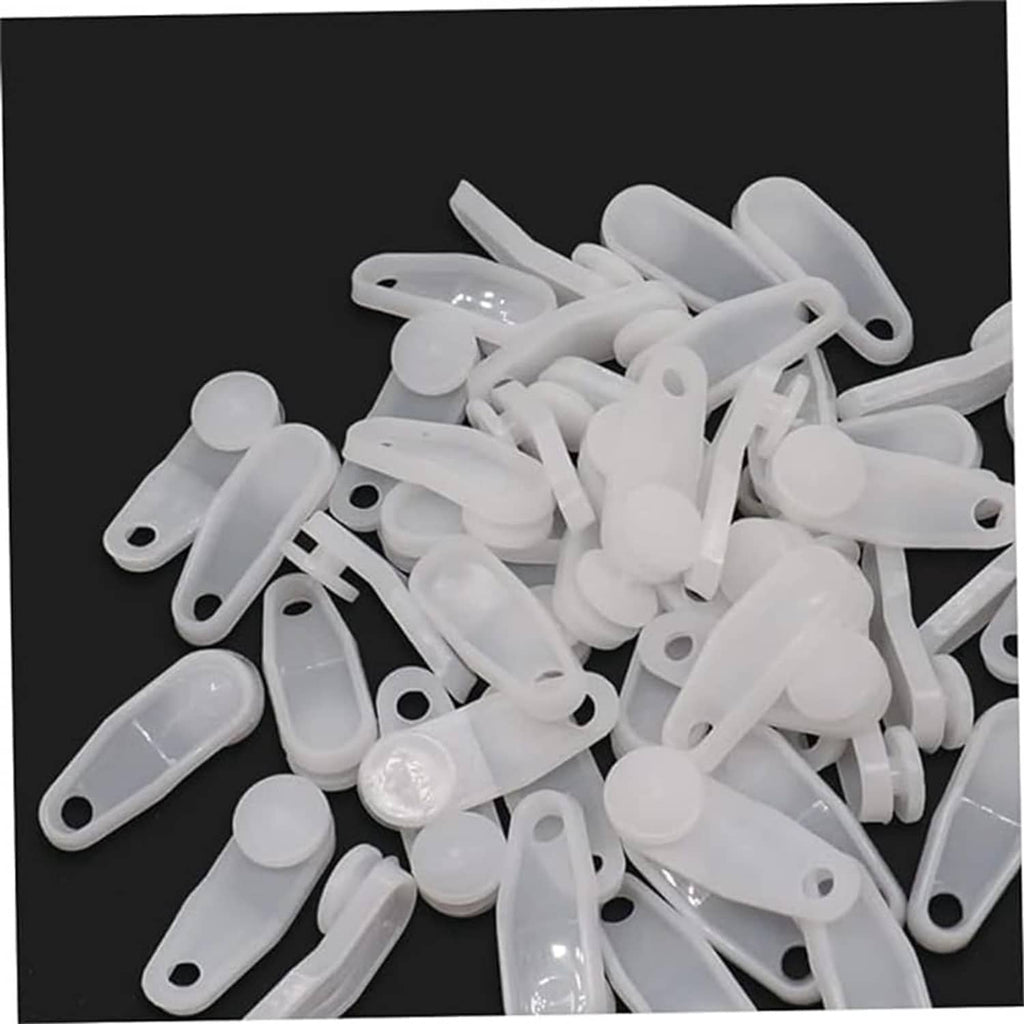 Pile of white plastic snap-in curtain traverse rod slides