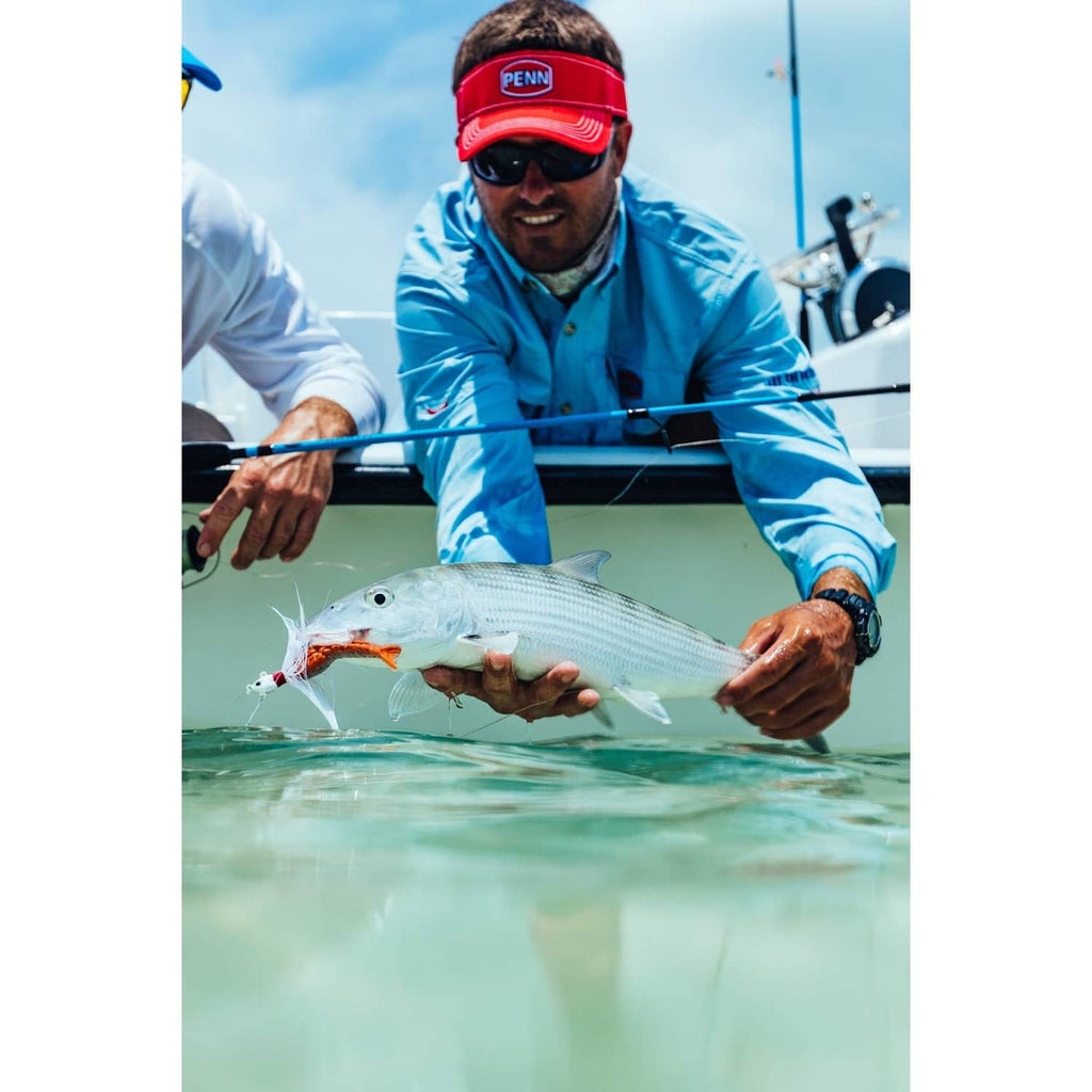 Fishing catch with shrimp-shaped soft bait attached to the hook