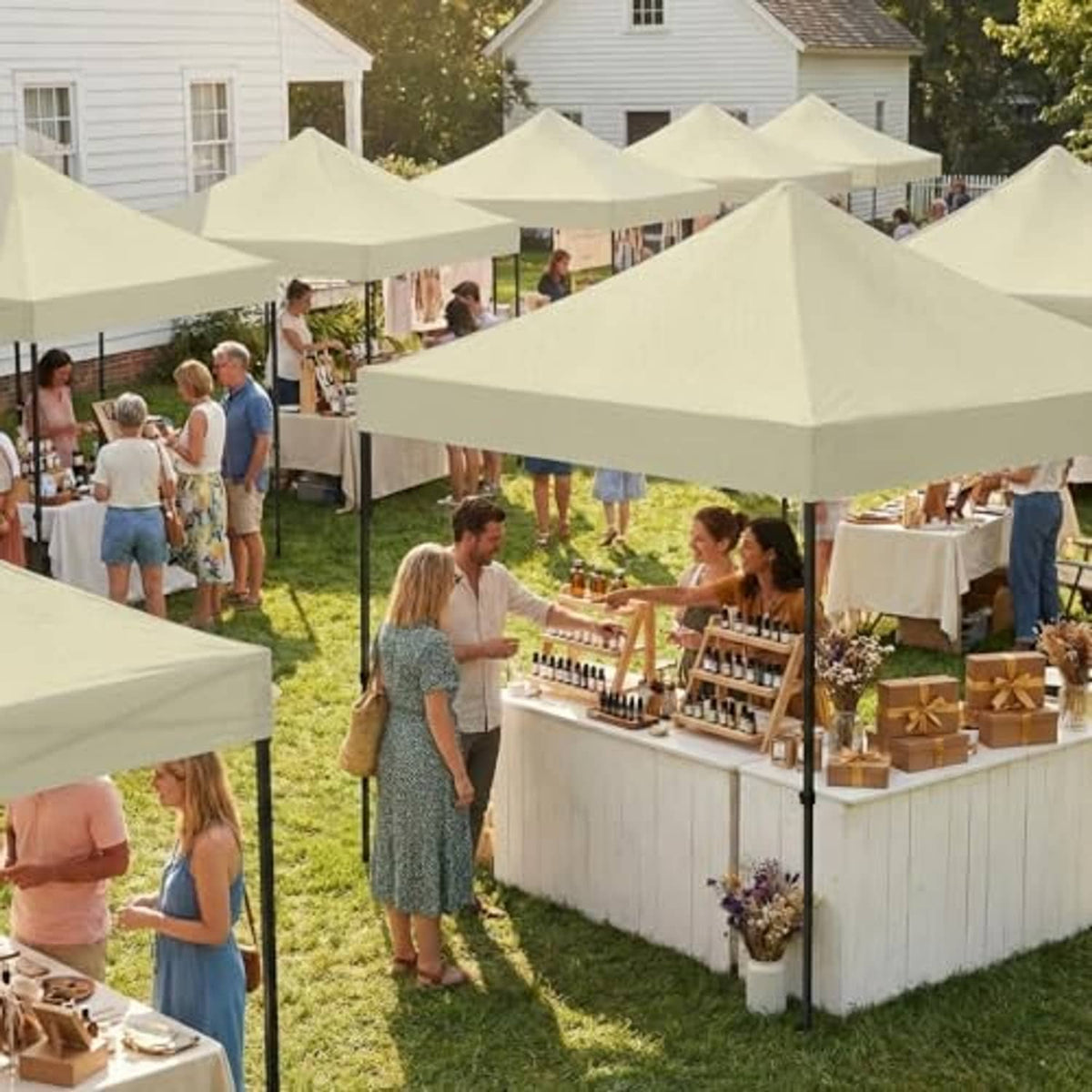 Beige canopy tops at outdoor market with peaked roofs and support poles