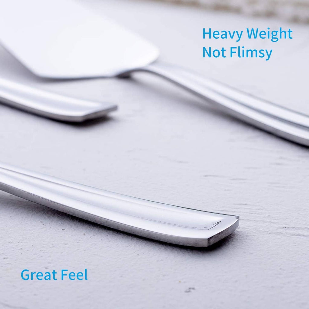 Close-up stainless steel pie cake server blade with rounded edge and white surface