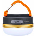 Orange-handled rechargeable LED camping lantern with dark base and USB output port
