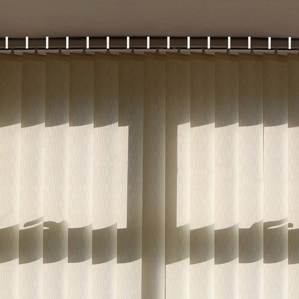 Light beige striped window blinds with white top valance