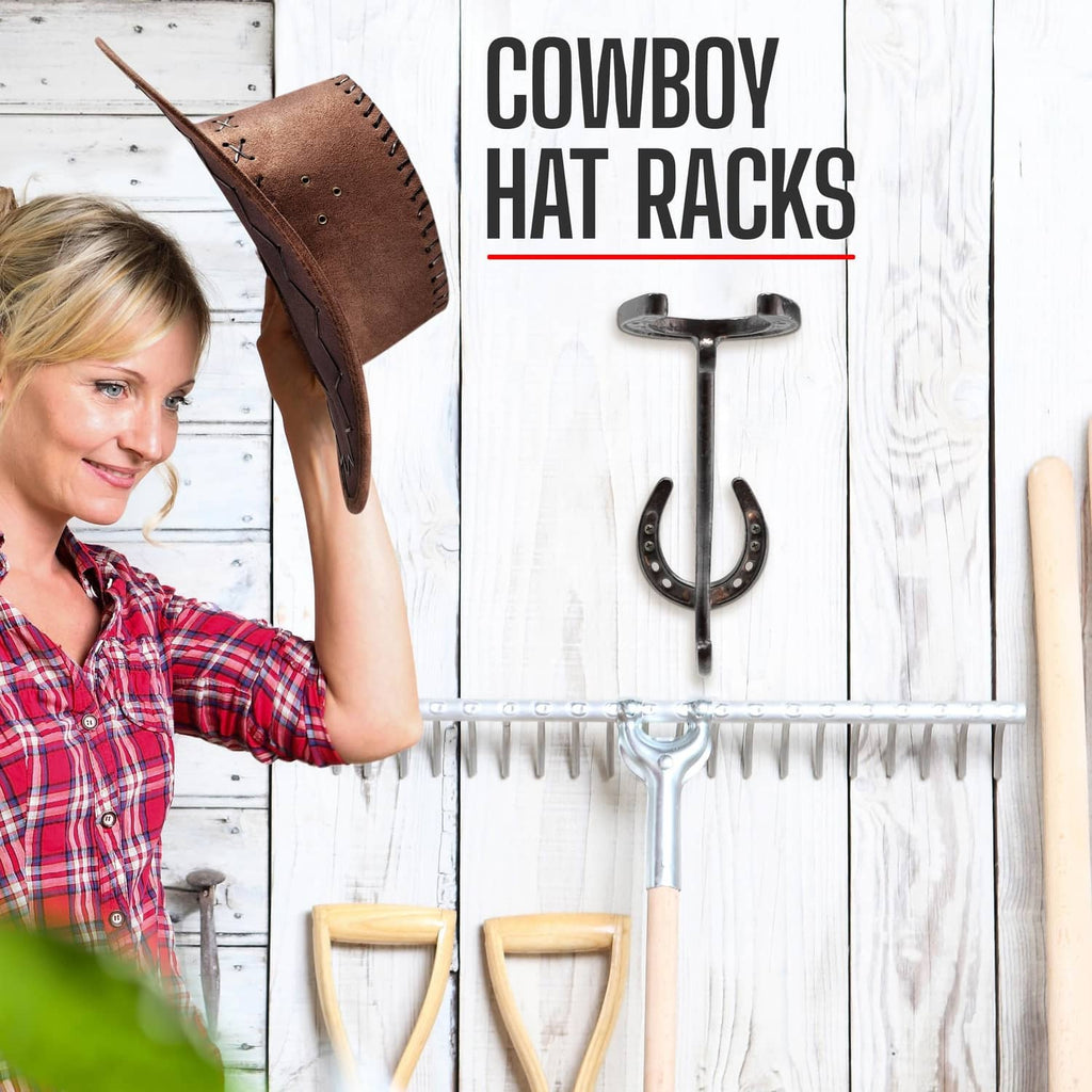 Cowboy hat rack with dark metal U-shaped hooks on a wood board holding a hat.
