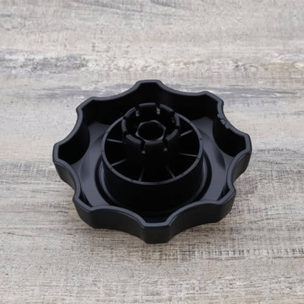 Black car seat adjustment knob underside with circular gear pattern