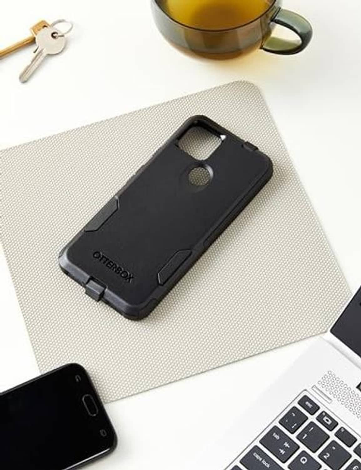 Black OtterBox slim phone case with camera cutout and protective bumper details