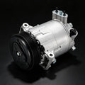 Air conditioning compressor with clutch pulley, silver housing and black belt drive.