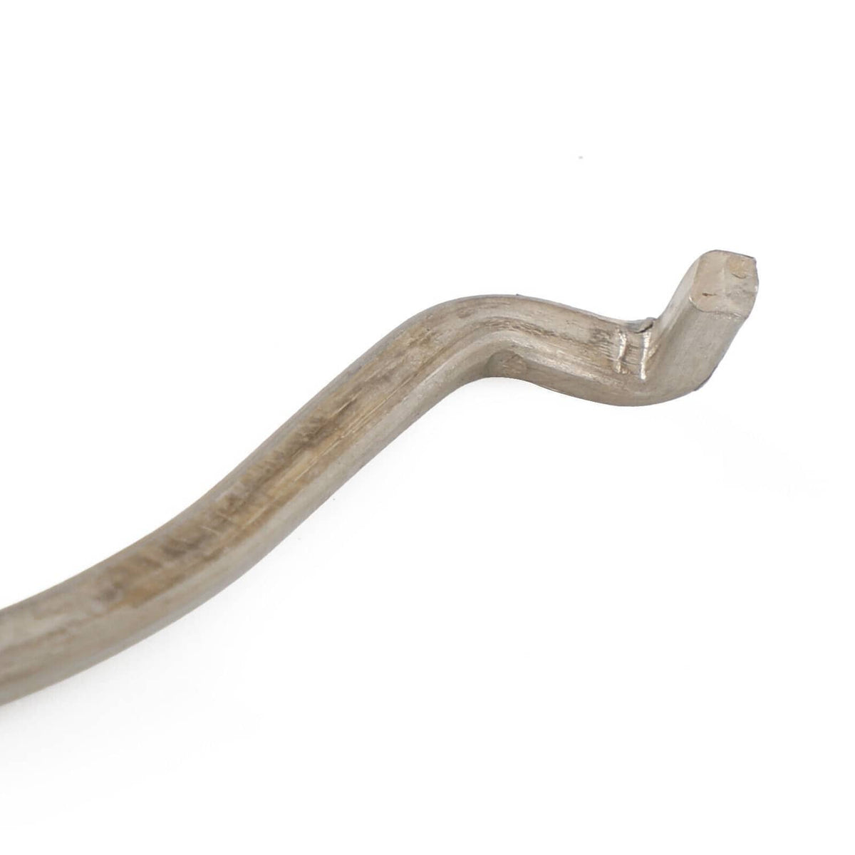 Close-up of silver gasket/retainer with molded beige sealant