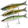 Set of three green-and-white glide baits with treble hooks and fin tails