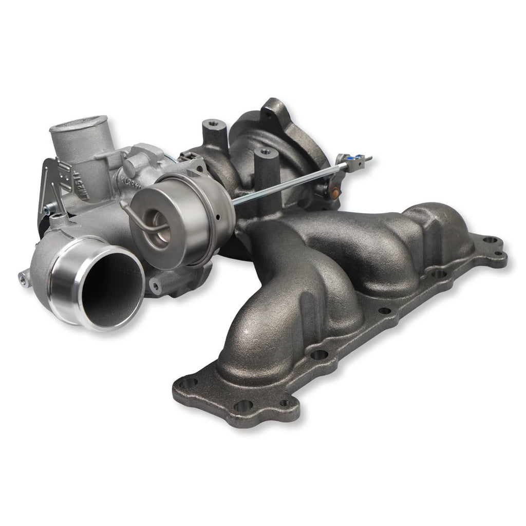 Turbocharger assembly with silver intake housing and black exhaust manifold, angled