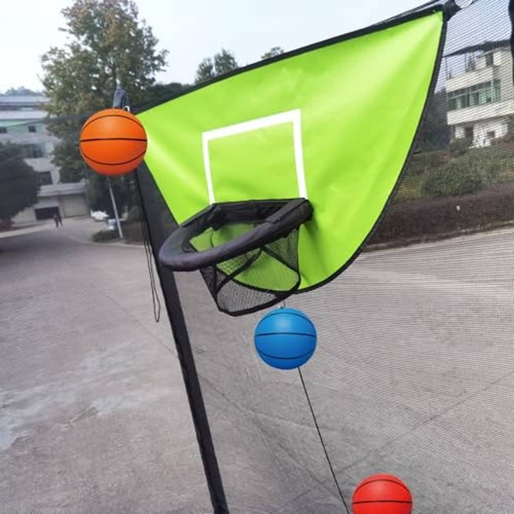 Green trampoline basketball hoop corner with black rim and mini basketballs