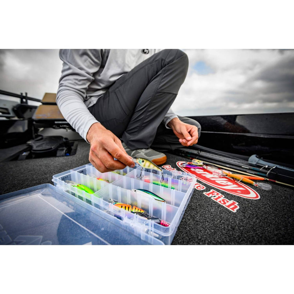 Crankbait lures in clear tackle box compartments with assorted colors