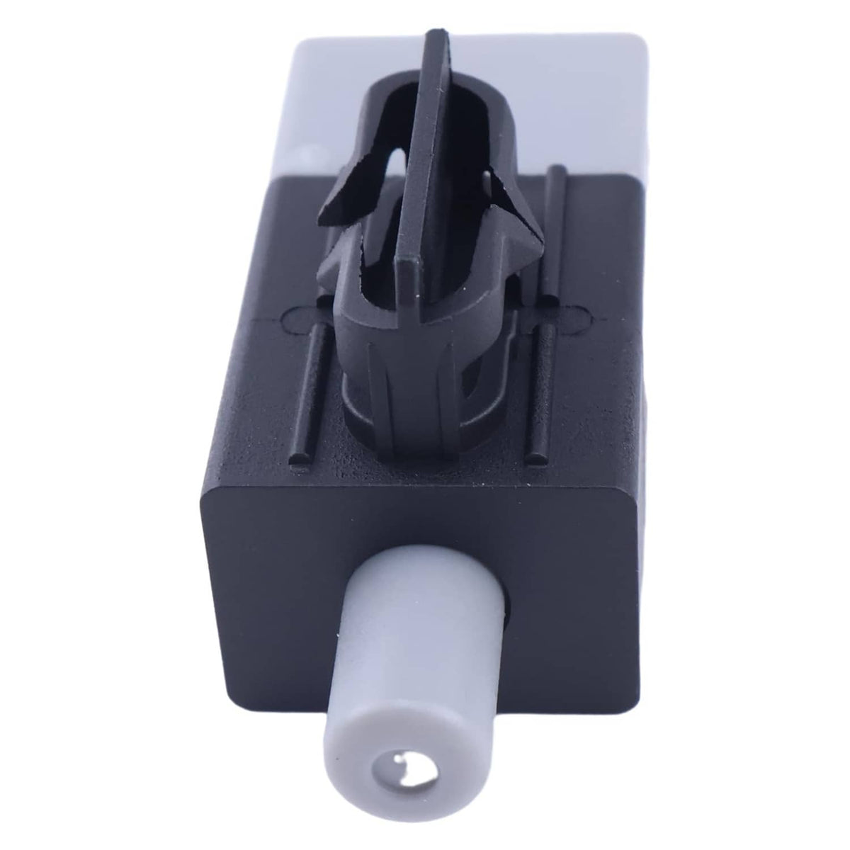 Close-up of interlock switch actuator with black housing and gray plunger button
