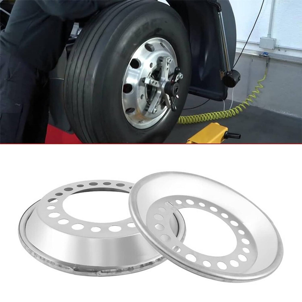 Two silver steel wheel balancer discs with perforated outer ring and openings