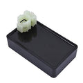 Black ignition control box with white multi-pin connector