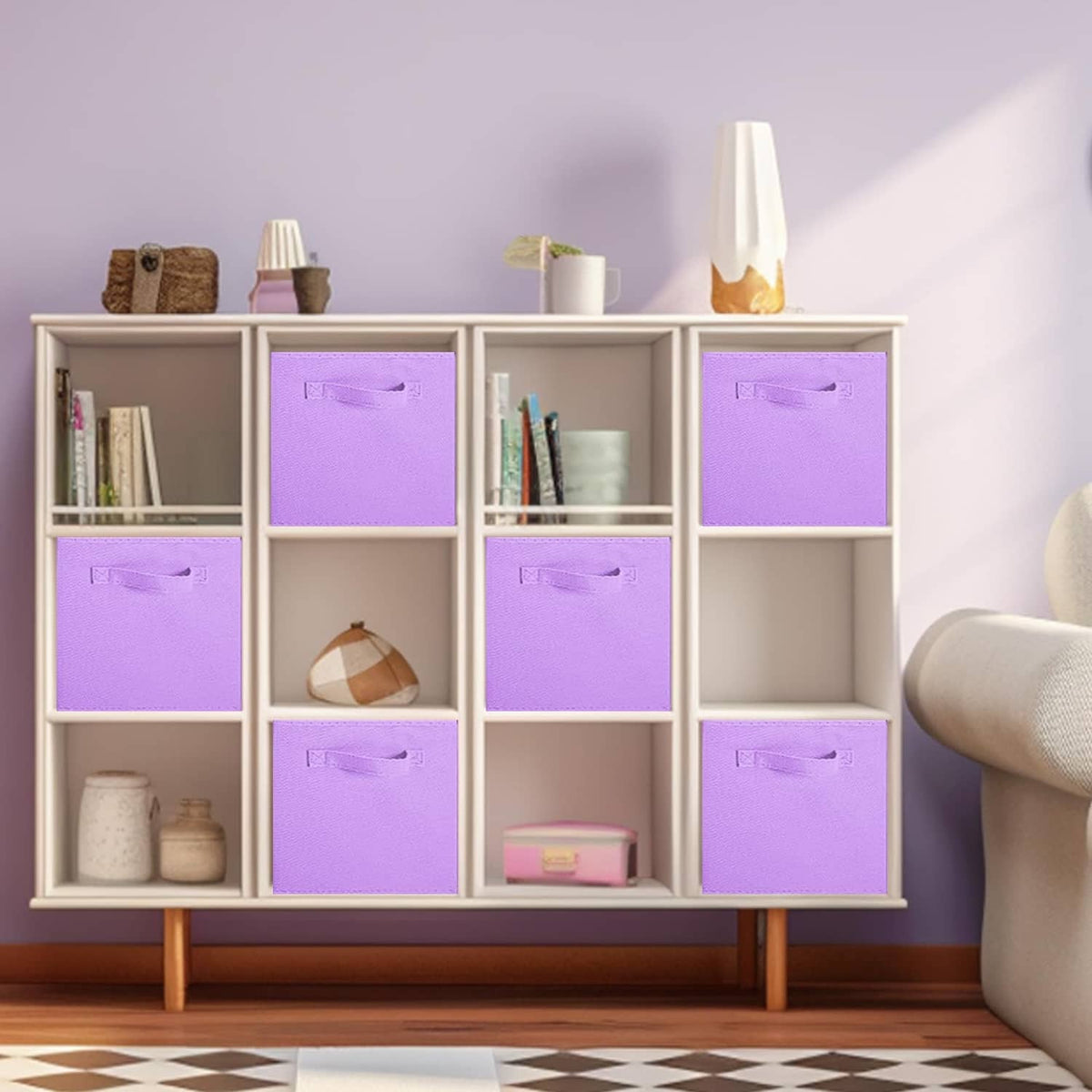 Lavender foldable fabric cube bins with top pull handles inside a shelf cabinet