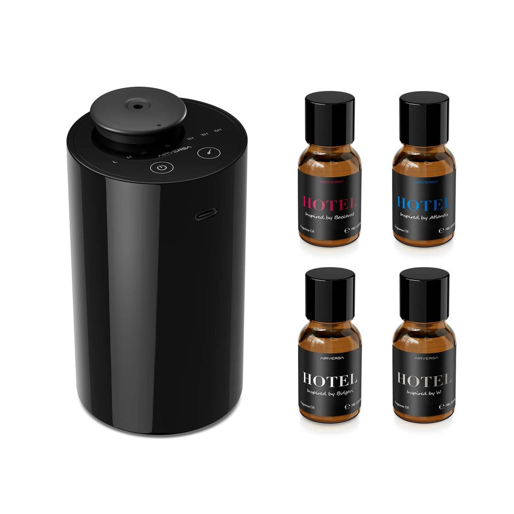 Black waterless essential oil diffuser with four amber aroma oil bottles