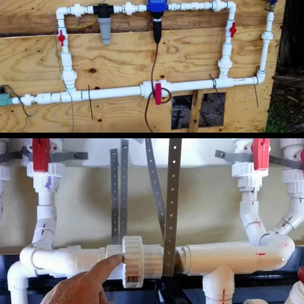 White PVC union coupling connecting plumbing pipes on a wall-mounted setup