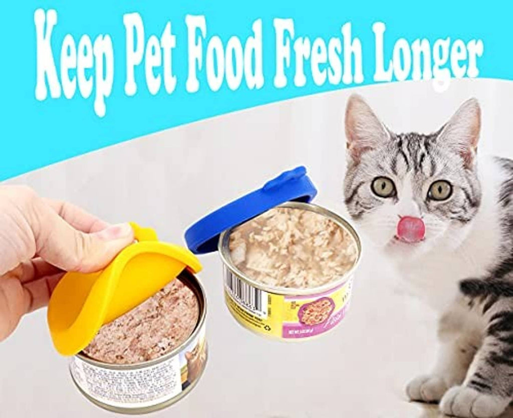 Silicone pet food can lids in yellow, blue, and orange, one being placed