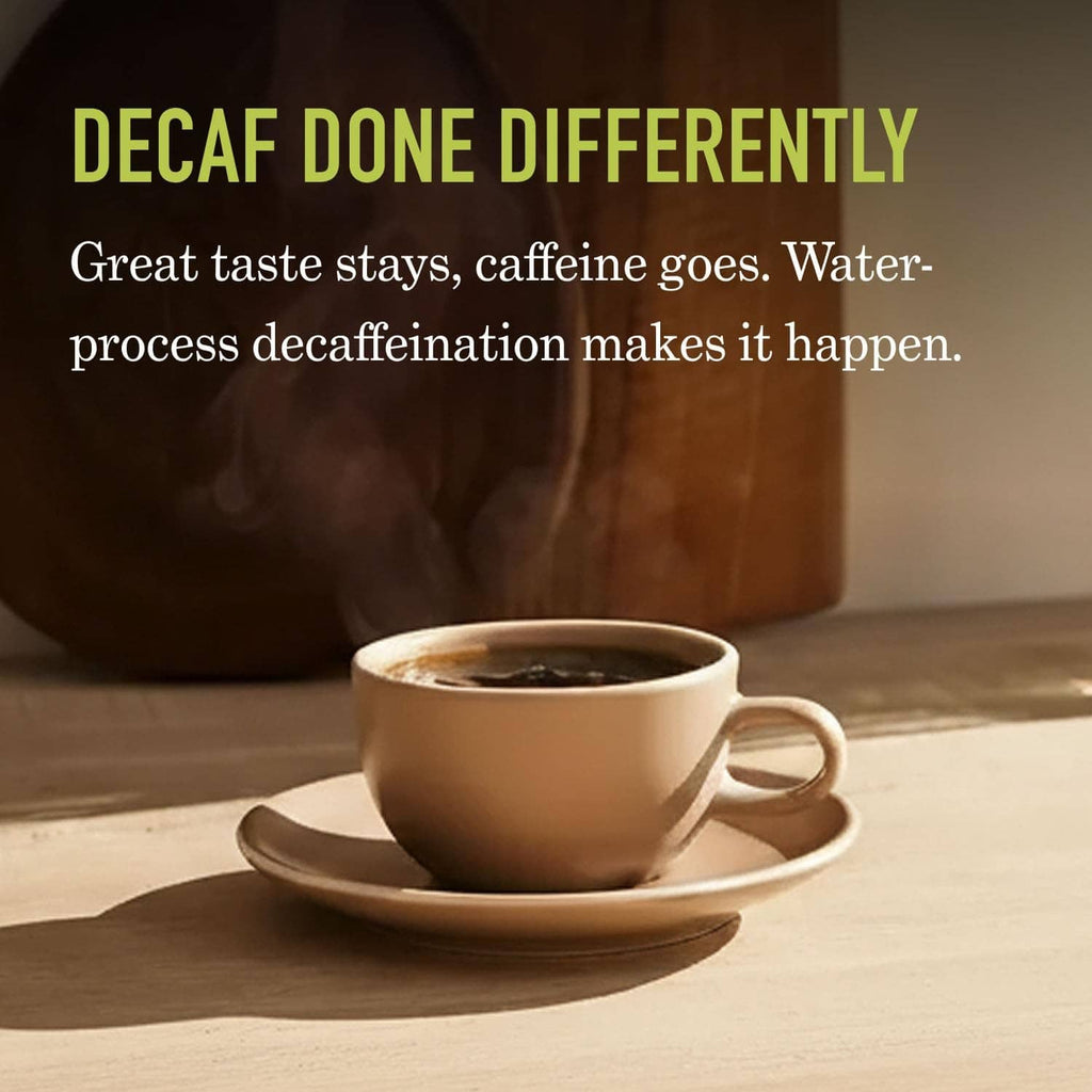 Decaf coffee cup on saucer with dark roasted coffee beans in background