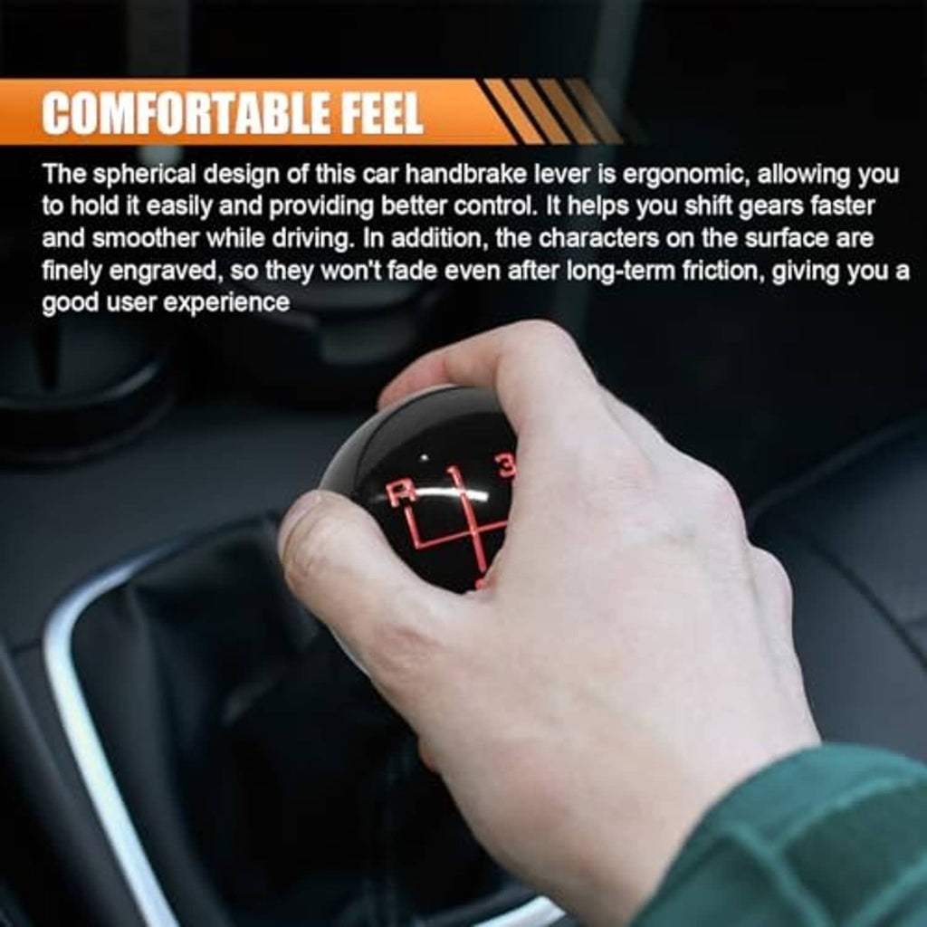 Black 6-speed shift knob with red numbers held by a hand
