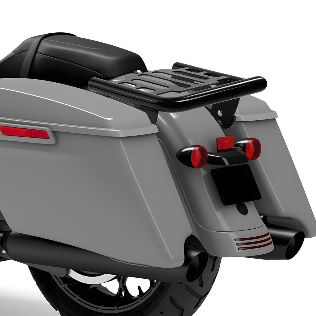 Black slotted luggage rack mounted on rear of motorcycle with support arms and brackets