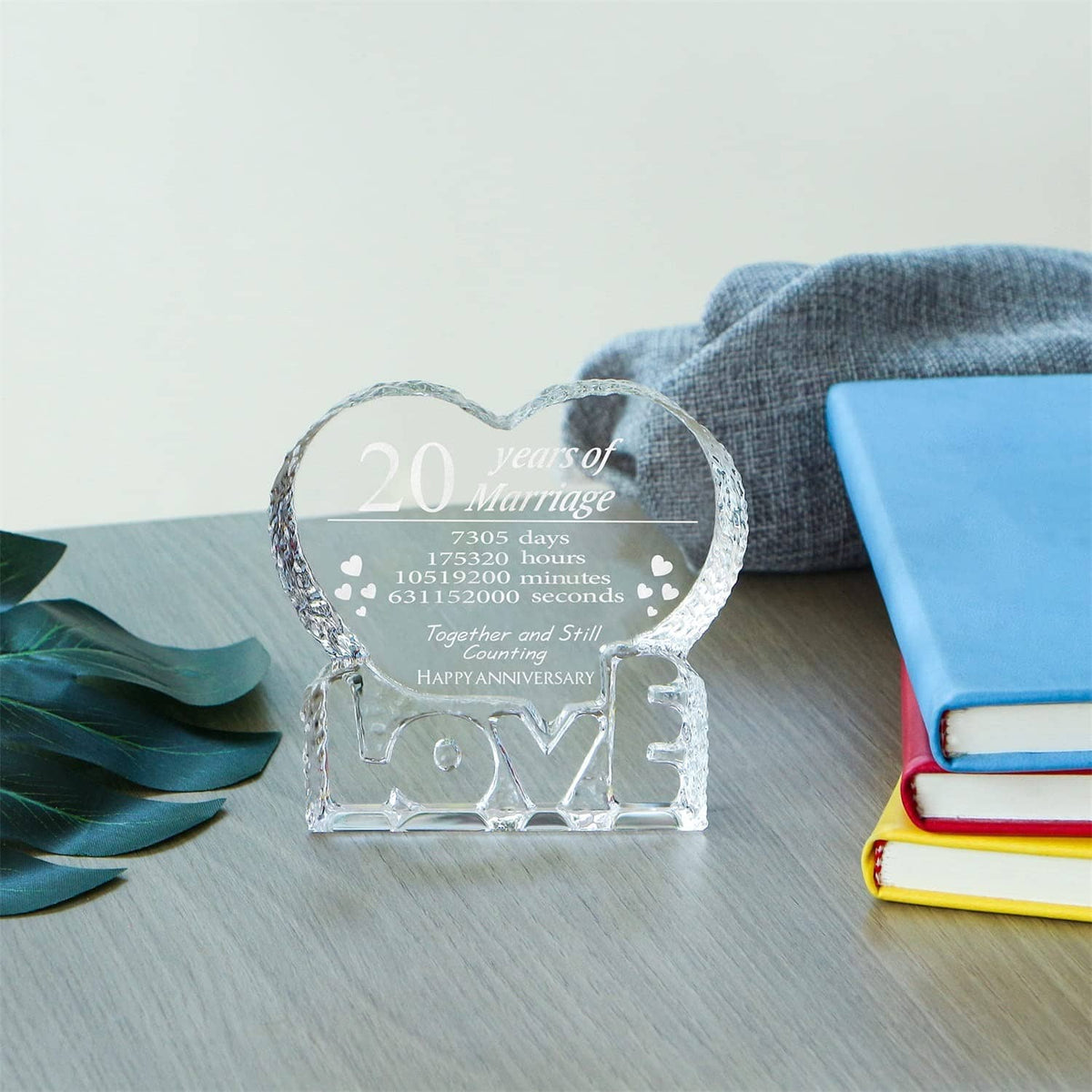 Engraved crystal heart keepsake on couch table with 20 years of Marriage panel and LOVE