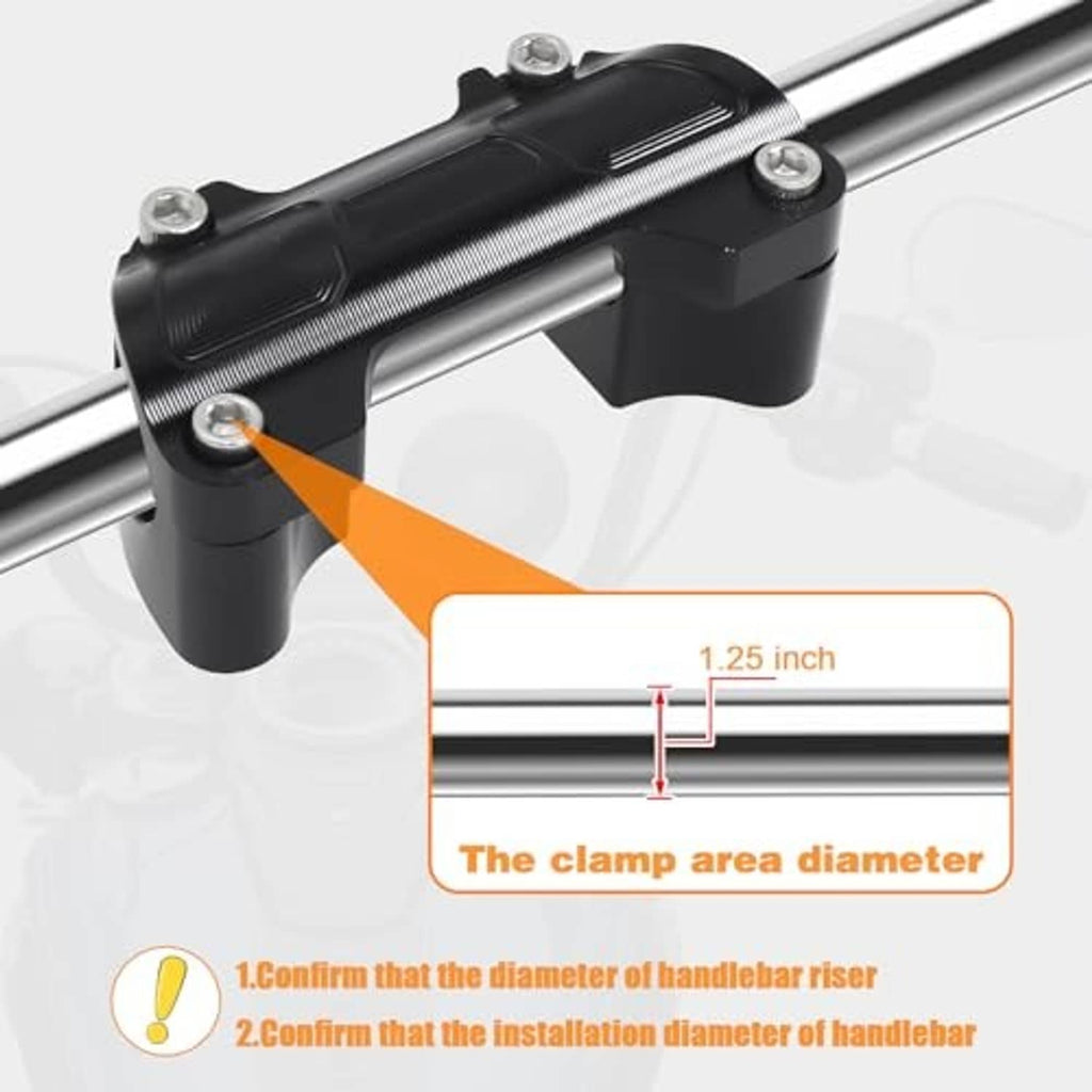 Black handlebar riser top clamp mounted on a silver handlebar bar, with top bolts