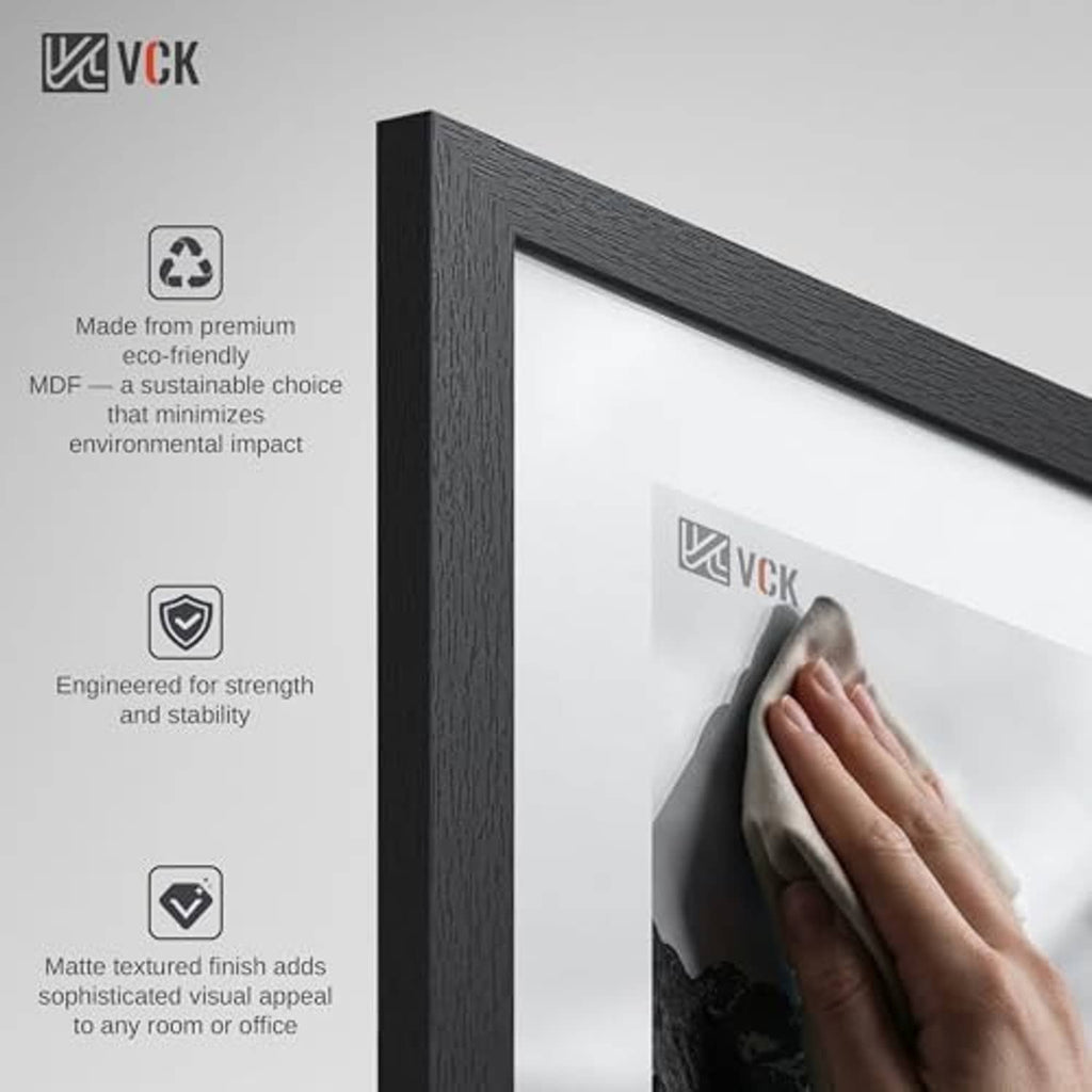 Black textured picture frame close-up, hand inserting the photo