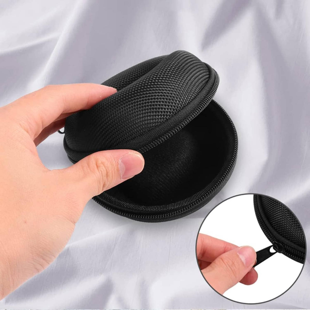 Open black zippered watch case with cushioned molded interior and zipper detail