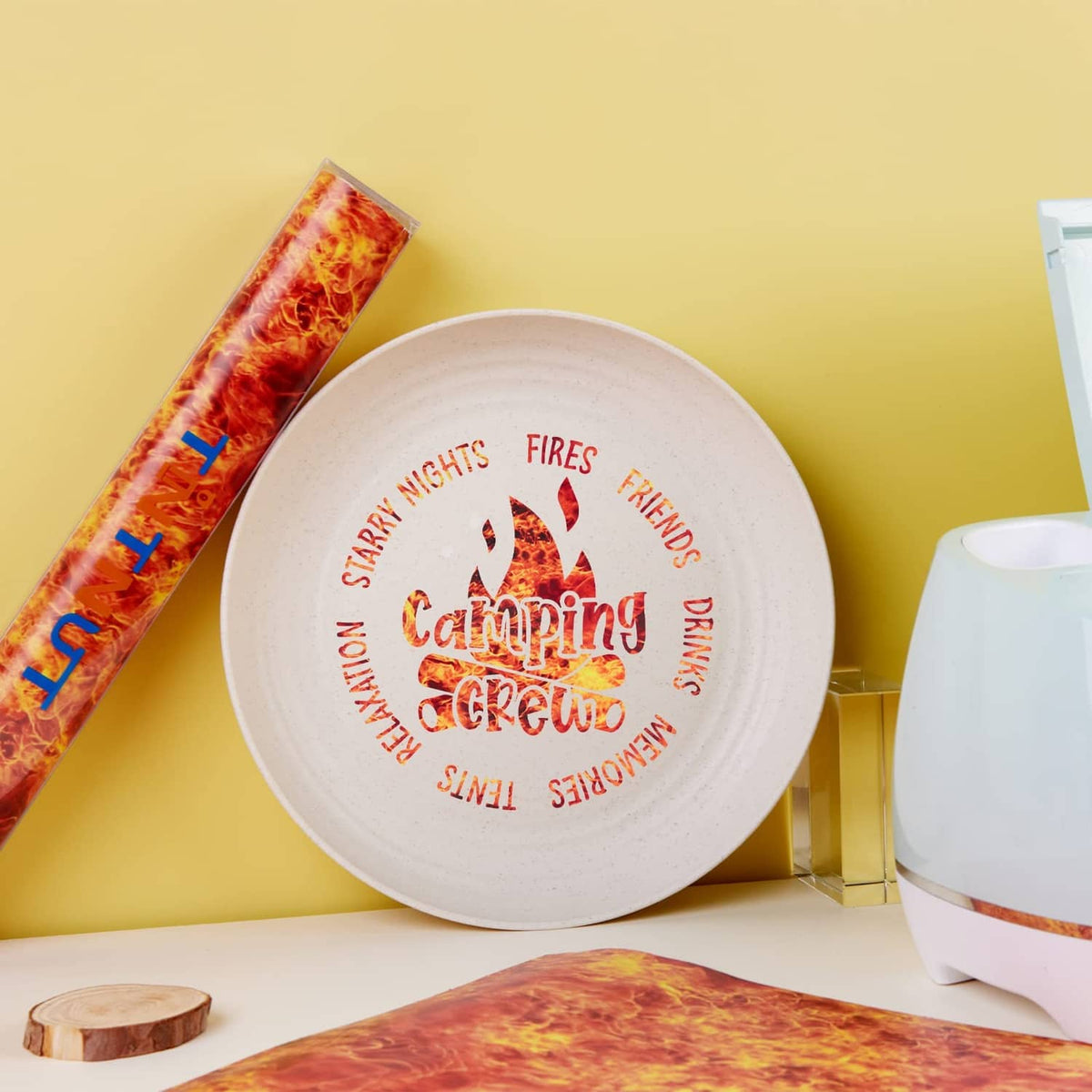 Flame vinyl roll with fiery orange-red pattern and a cut strip for crafting
