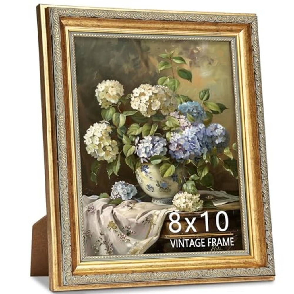 Vintage-style rectangular gold picture frame with clear glass and distressed edging, floral vase art