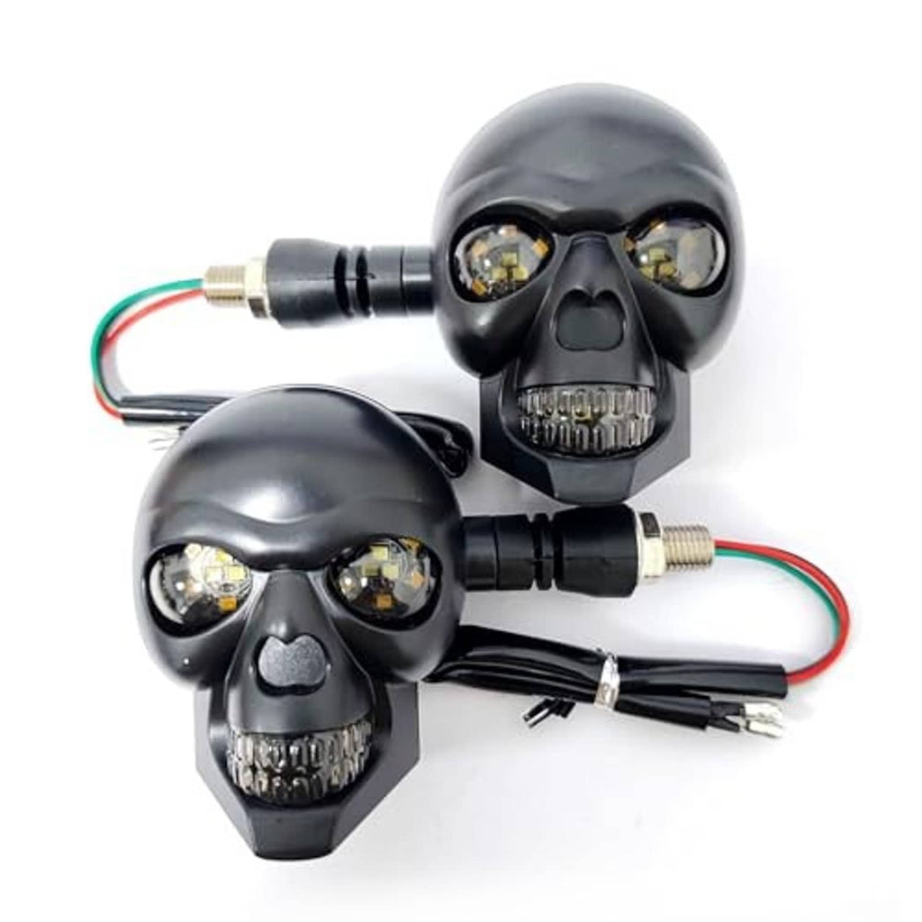 Skull motorcycle turn signal light set in black with amber LED bulbs and connected wiring