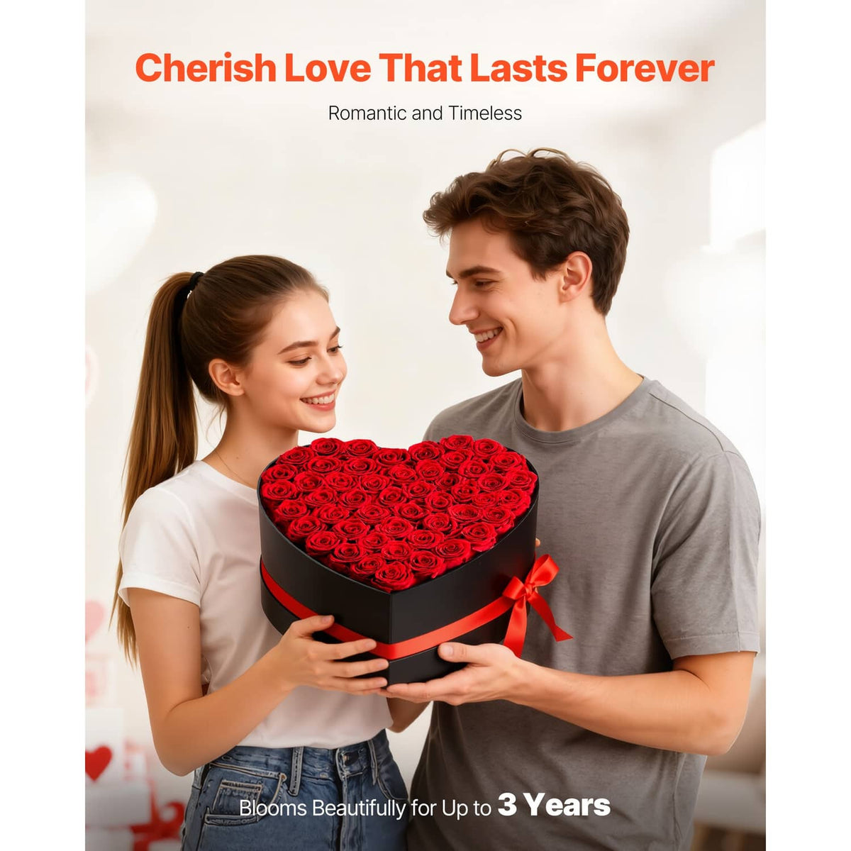 Heart-shaped preserved rose box held by two people with red rose top and ribbon