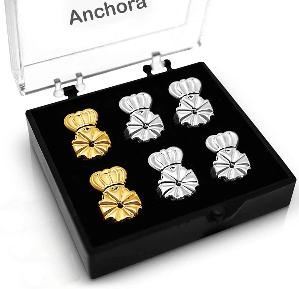 Earring back set with floral-style clips in silver and gold, in a display tray