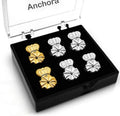 Earring back set with floral-style clips in silver and gold, in a display tray