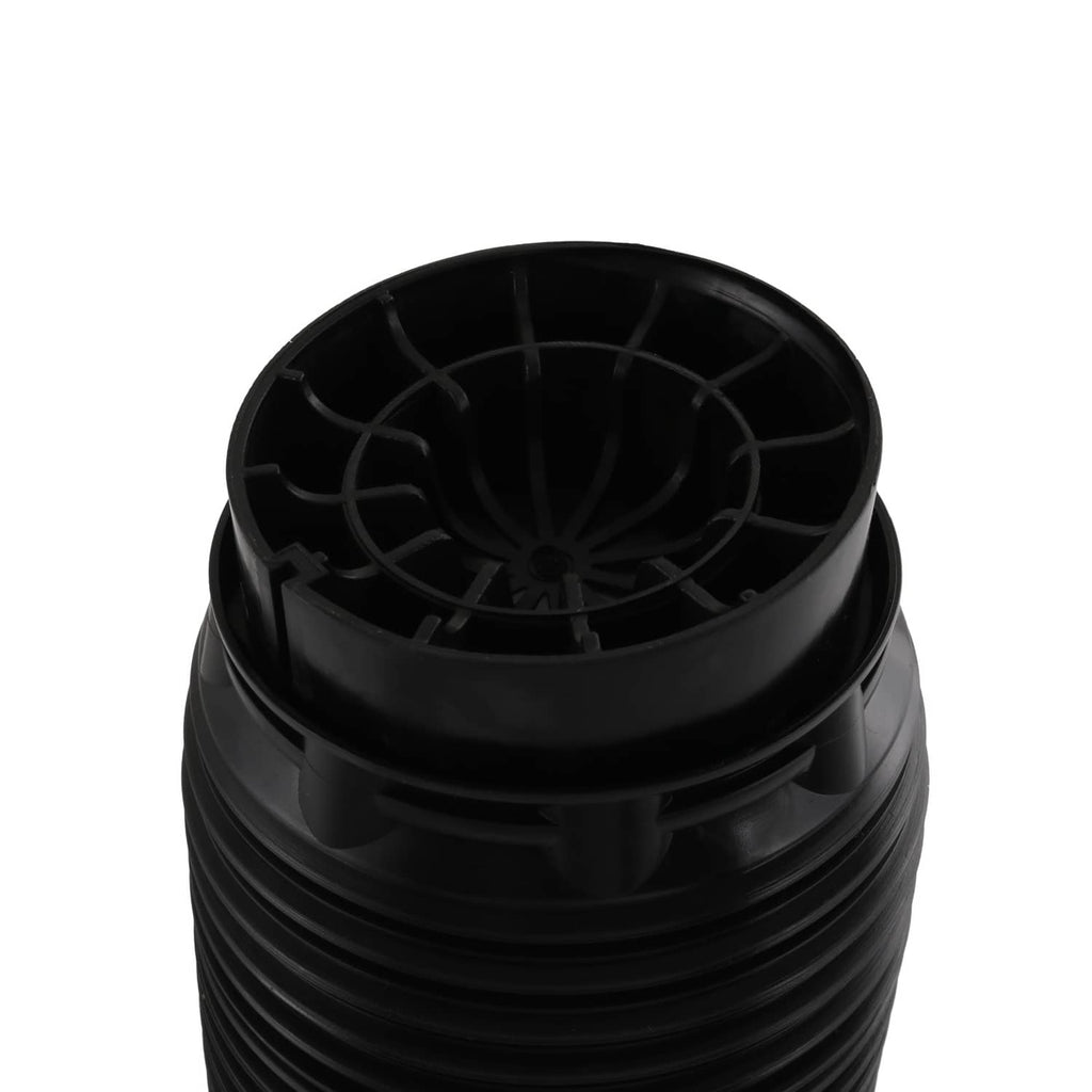 Air suspension strut end view with black plastic housing and molded vent channels
