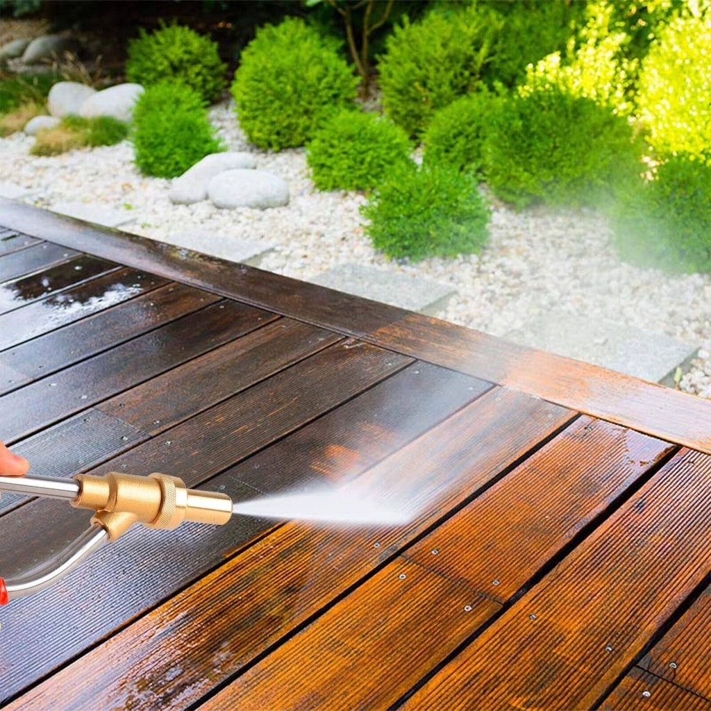 Pressure washer sandblaster applying sand stream to a wooden deck surface