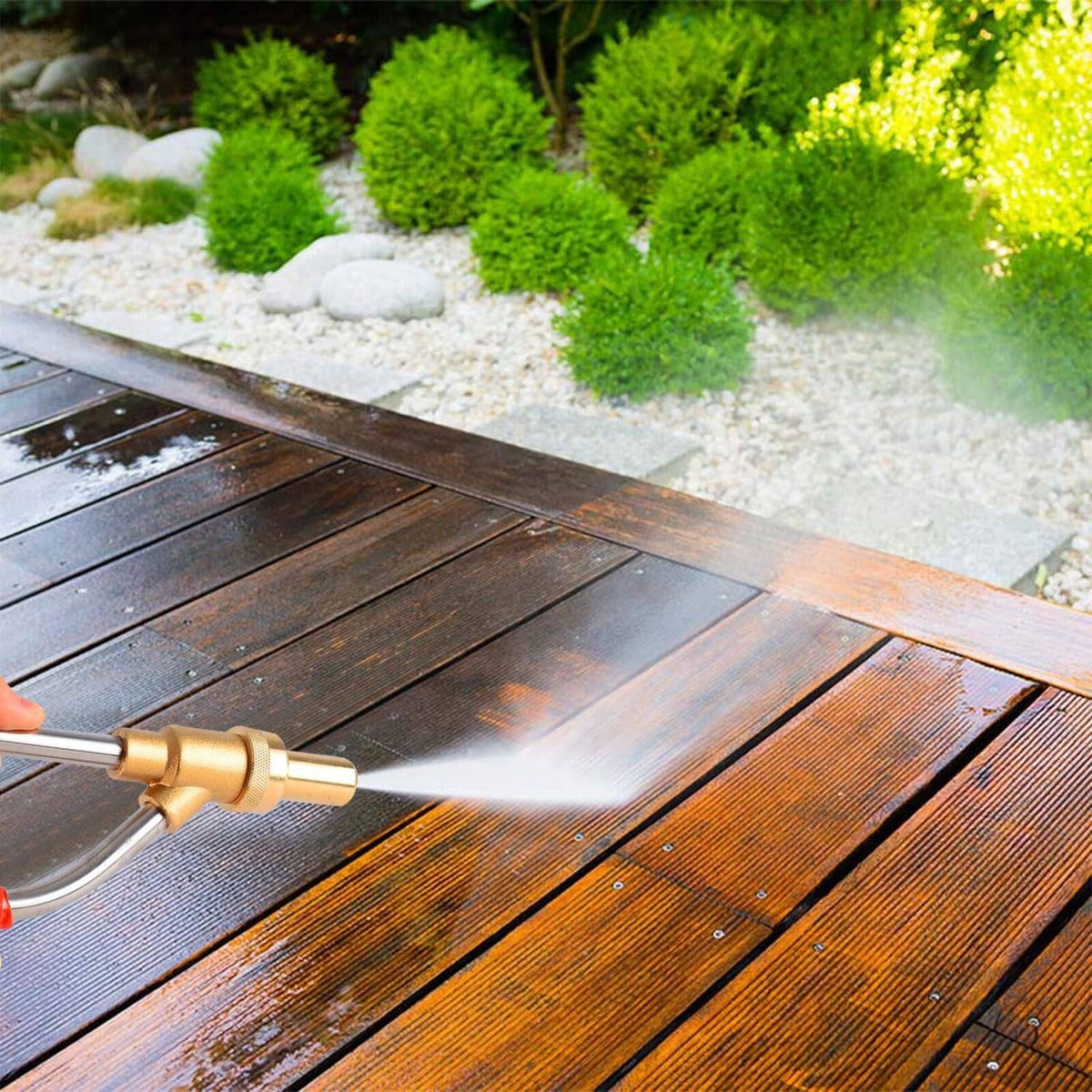 Pressure washer sandblaster applying sand stream to a wooden deck surface