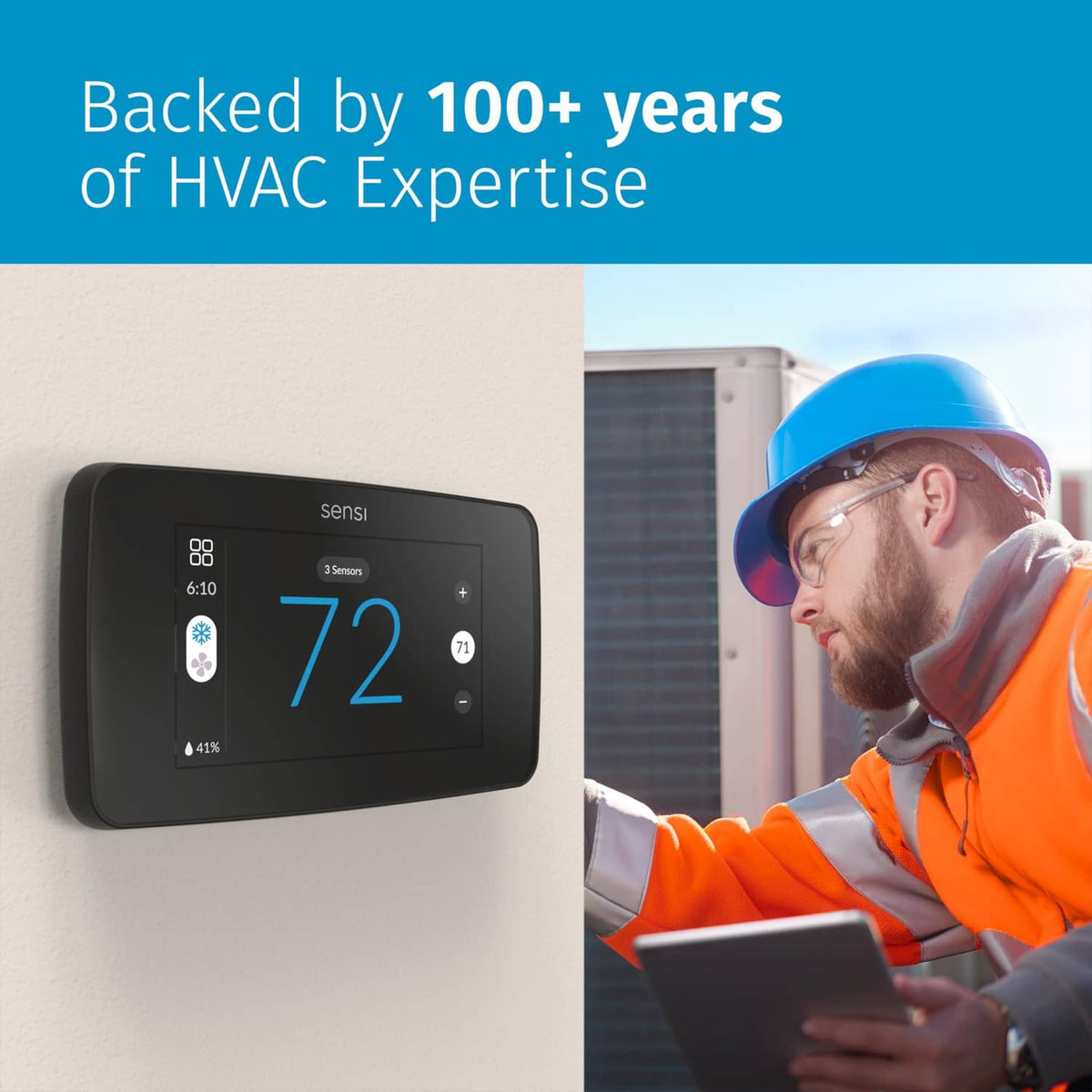 Black touchscreen smart thermostat mounted on wall beside an HVAC technician